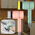 Electric handheld scrubbers with interchangeable brush and sponge heads in kitchen setting